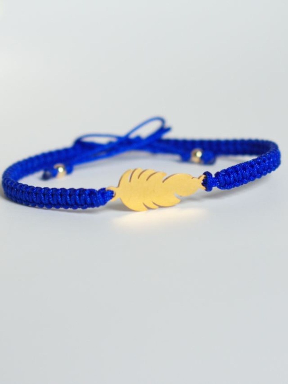Gold Feather Bracelet on Cobalt Blue Macramé Cord